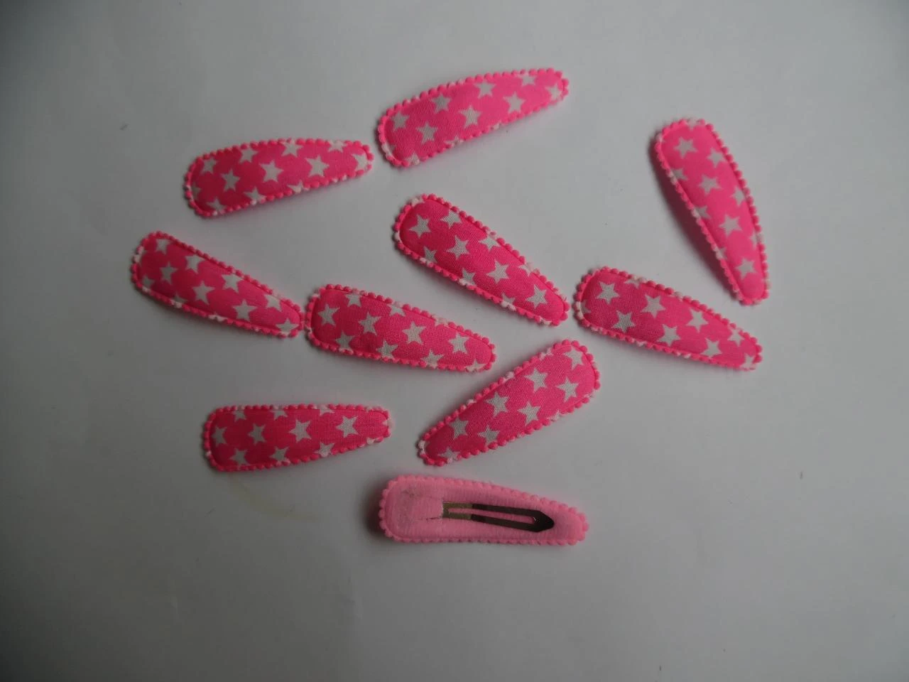 Partij 10 haarspeldjes 5 cm felroze met sterren